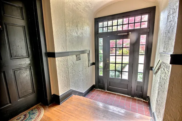 a bedroom with a bed and a mirror