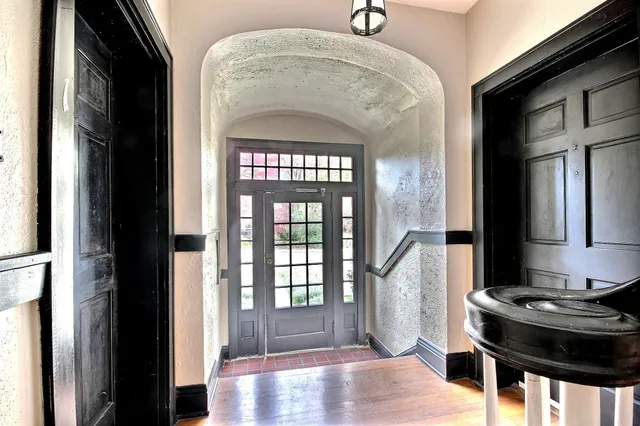 a view of entryway livingroom and hall