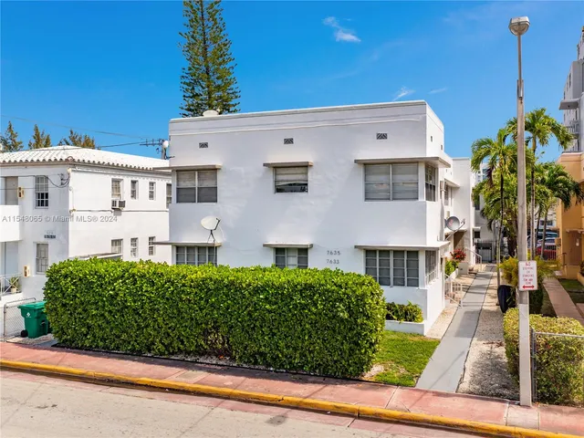 a view of a patio with table and chairs and potted plants