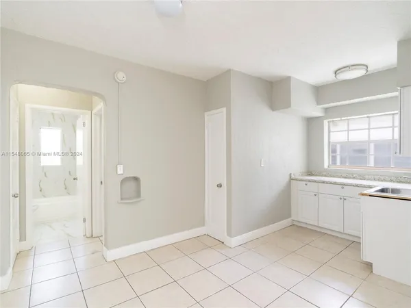 a view of a livingroom with a ceiling fan and window