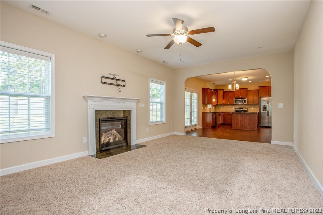 157 Shellbark Drive Spring Lake, NC 28390 - Photo 11 of 28 an empty room with windows and fireplace