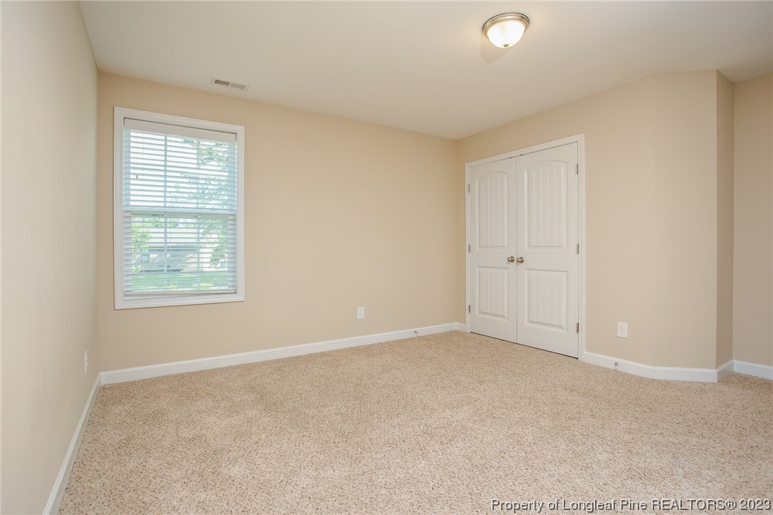 157 Shellbark Drive Spring Lake, NC 28390 - Photo 13 of 28 an empty room with windows
