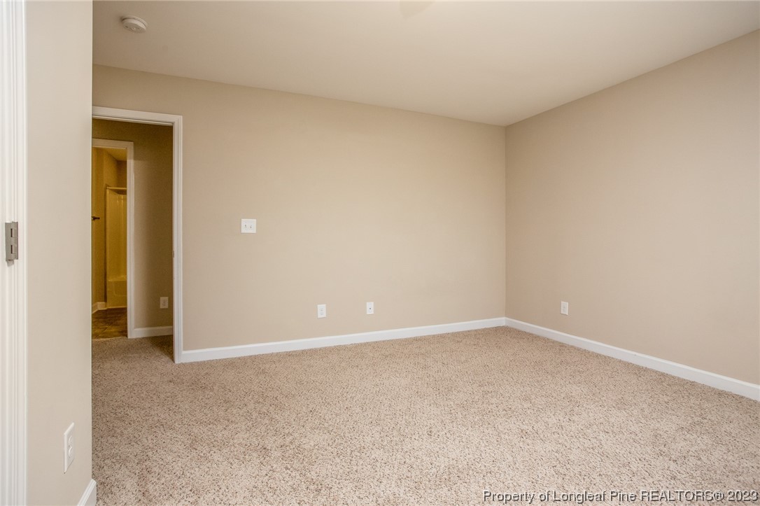 157 Shellbark Drive Spring Lake, NC 28390 - Photo 14 of 28 an empty room with closet and a bathroom
