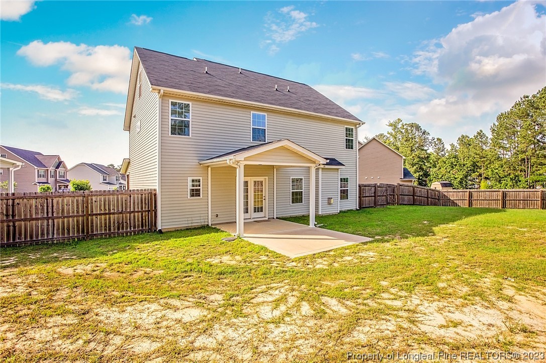 157 Shellbark Drive Spring Lake, NC 28390 - Photo 4 of 28 a view of a house with swimming pool and a yard