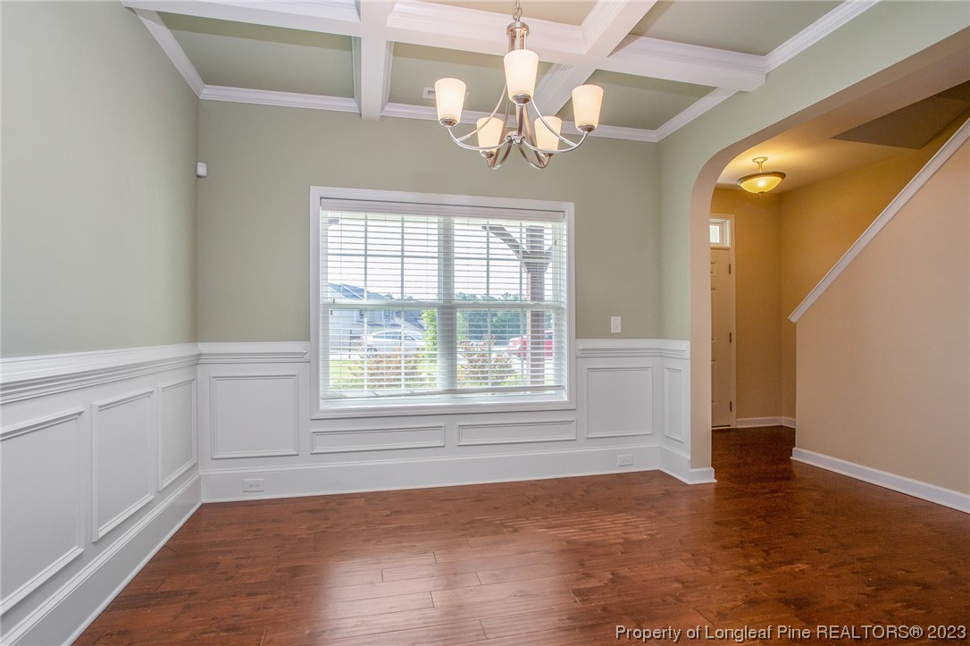 157 Shellbark Drive Spring Lake, NC 28390 - Photo 6 of 28 a view of an empty room with wooden floor and a window