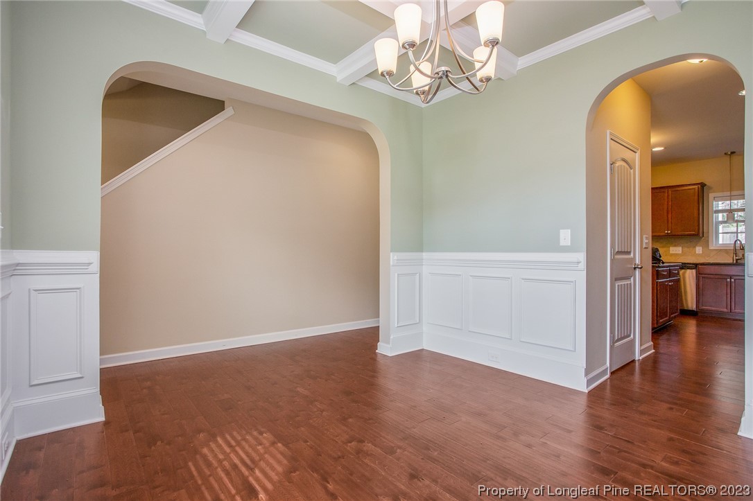 157 Shellbark Drive Spring Lake, NC 28390 - Photo 7 of 28 wooden floor in an empty room with a window