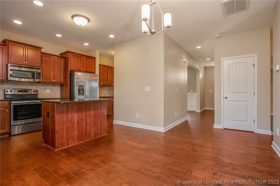 157 Shellbark Drive Spring Lake, NC 28390 - Photo 10 of 28 a view of kitchen with stainless steel appliances granite countertop a refrigerator and a stove top oven