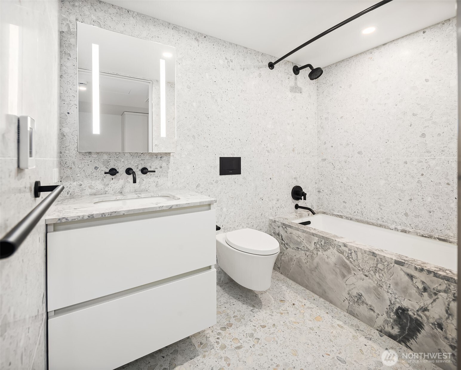 300 Virginia Street, Unit 3103 Seattle, WA 98101 - Photo 12 of 36 a bathroom with a sink toilet and shower