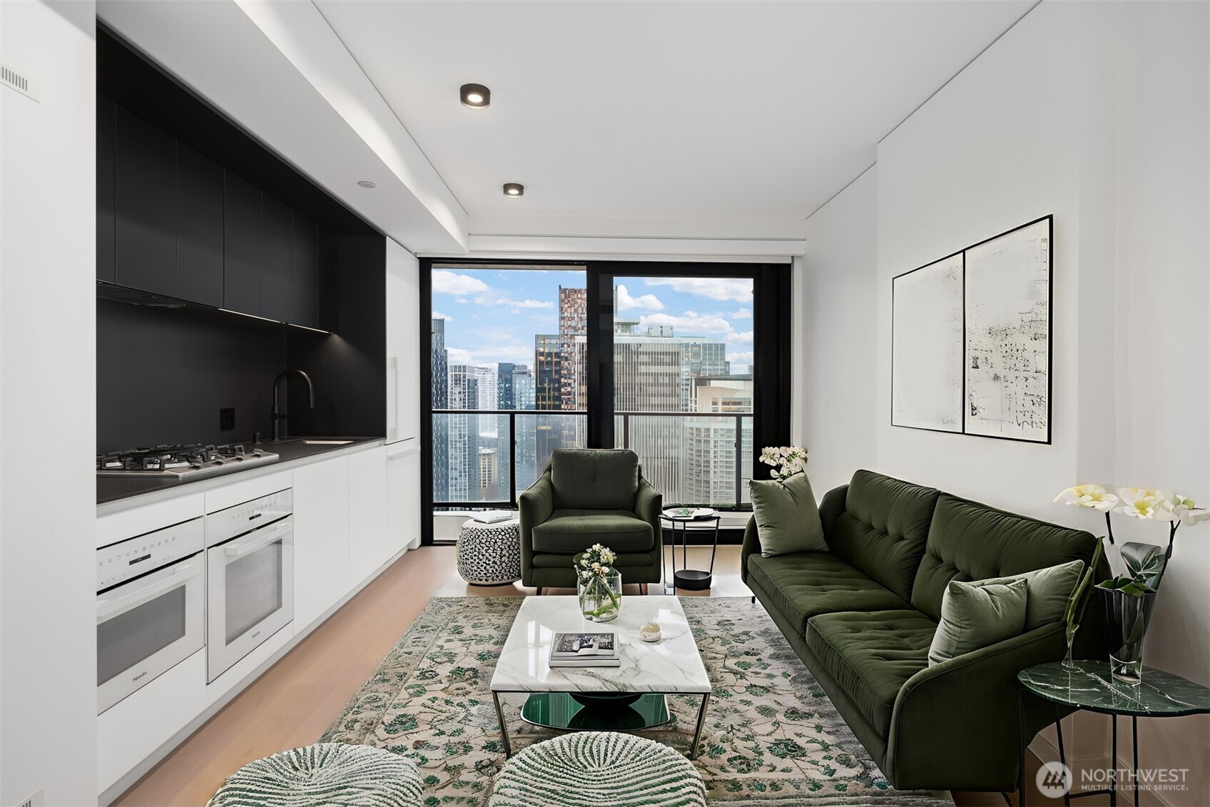 300 Virginia Street, Unit 3103 Seattle, WA 98101 - Photo 2 of 36 a living room with furniture a flat screen tv and a fireplace
