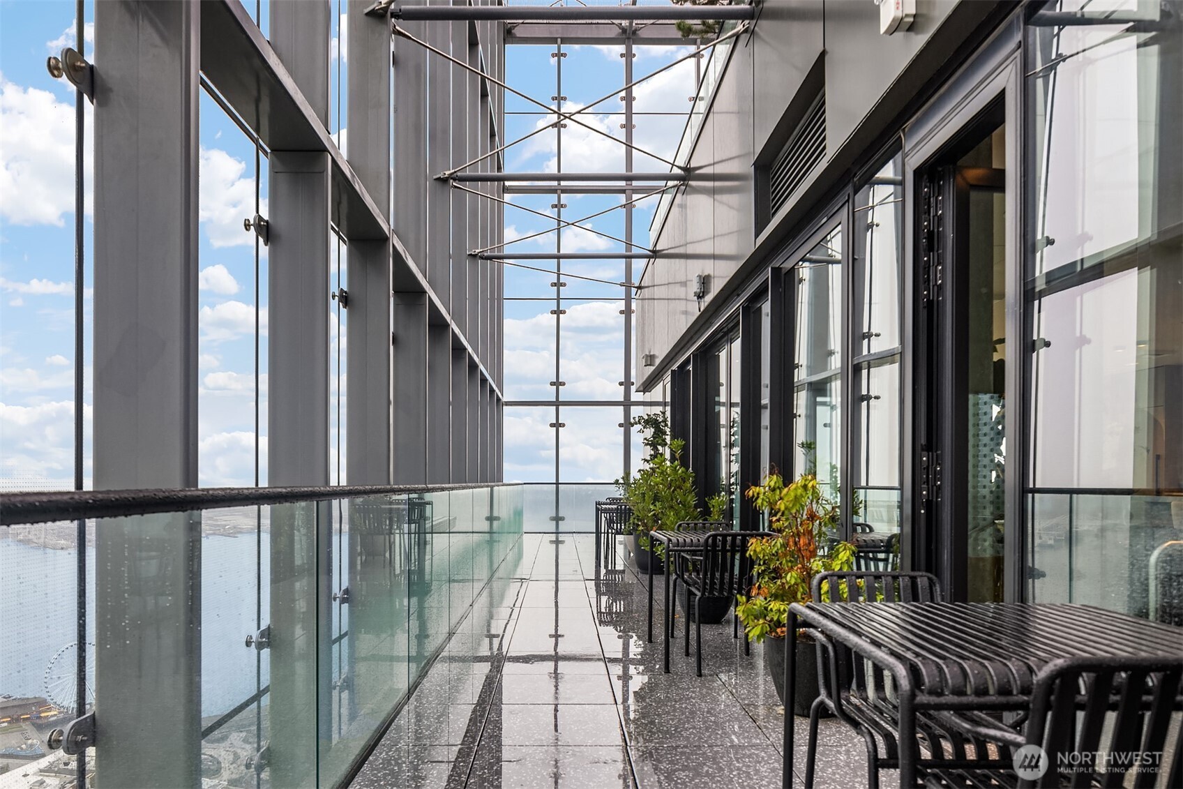 300 Virginia Street, Unit 3103 Seattle, WA 98101 - Photo 24 of 36 a view of an chairs and table in the balcony