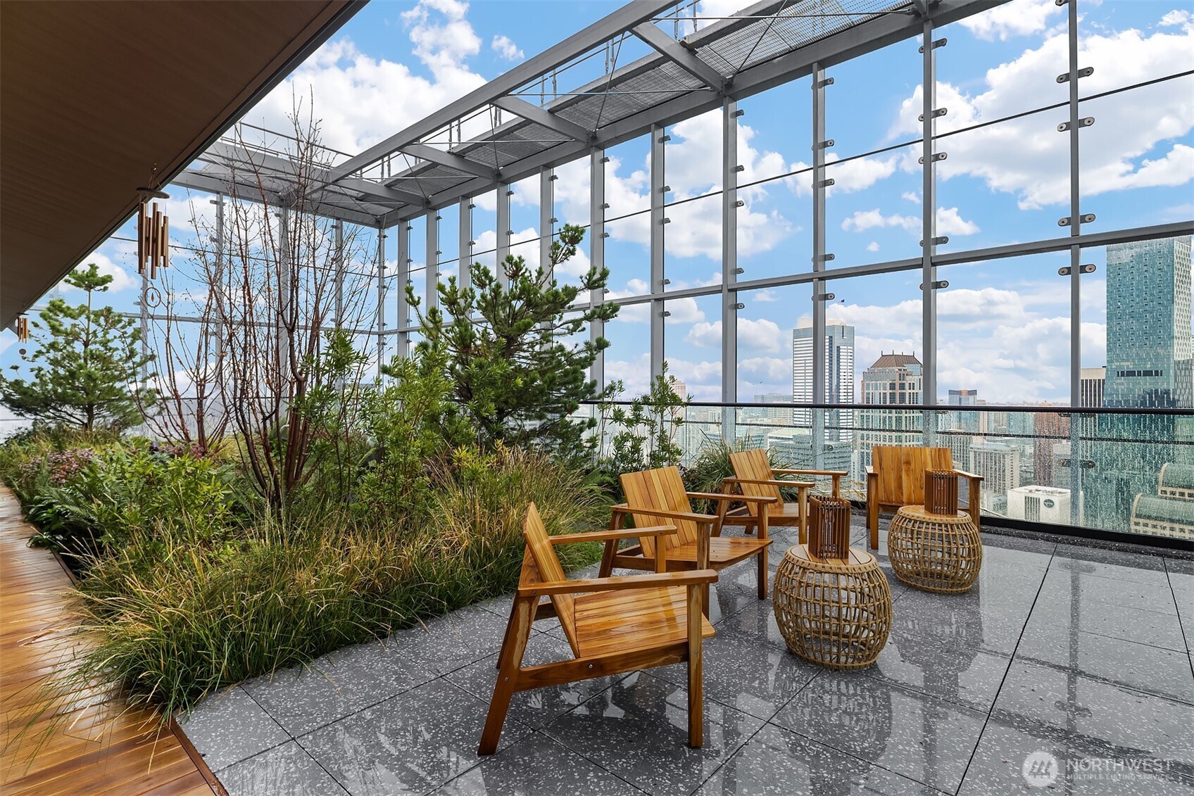 300 Virginia Street, Unit 3103 Seattle, WA 98101 - Photo 27 of 36 a balcony with chairs and with potted plants
