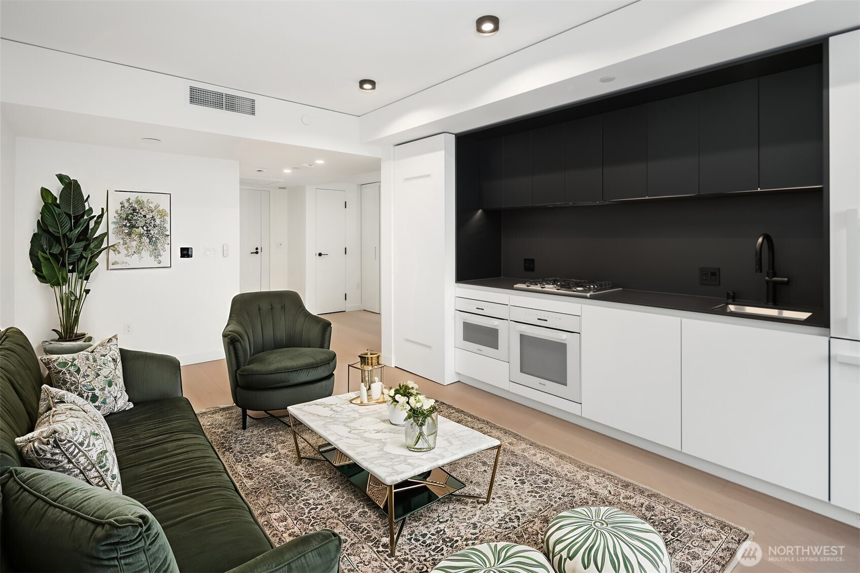 300 Virginia Street, Unit 3103 Seattle, WA 98101 - Photo 3 of 36 a living room with furniture and a flat screen tv