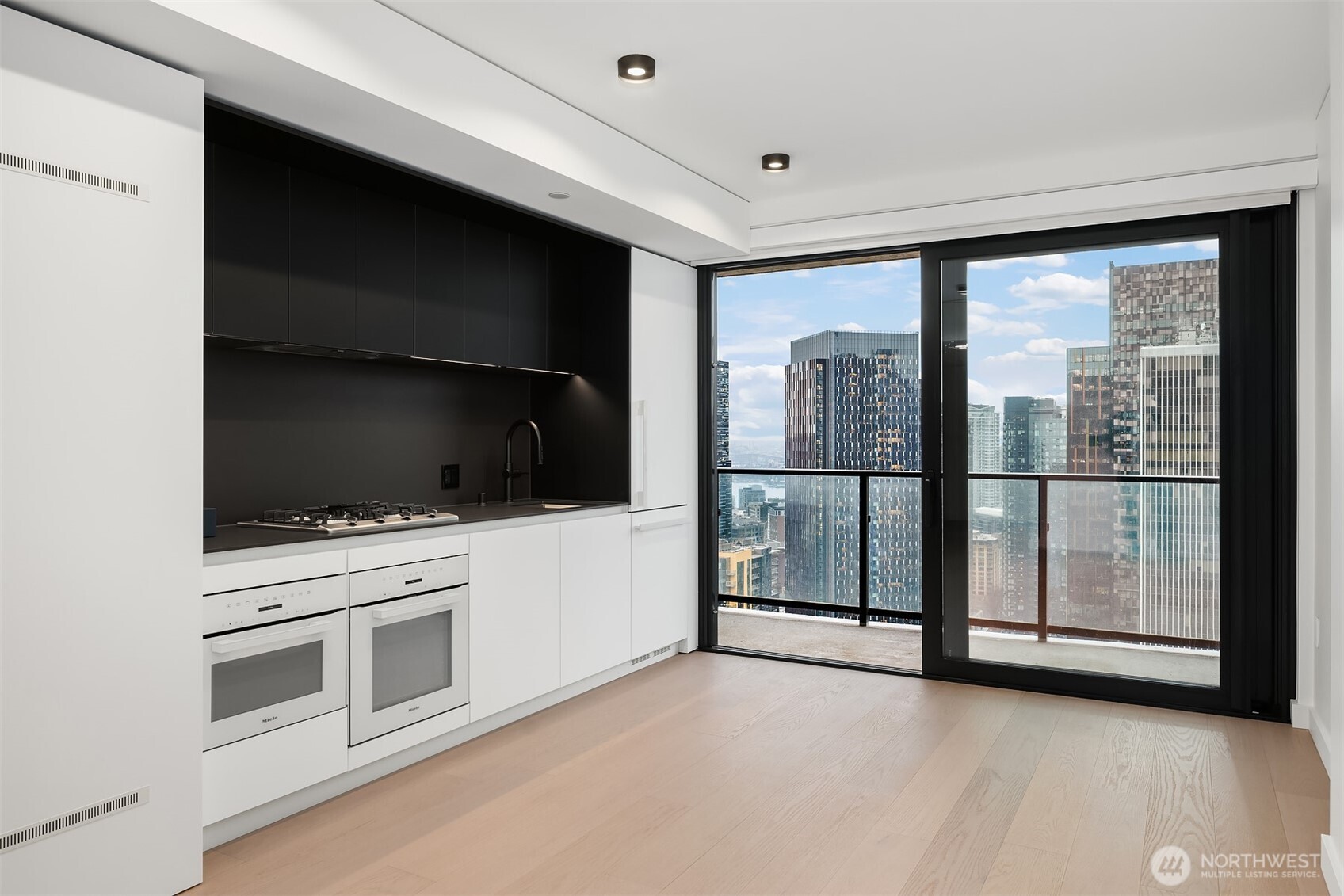 300 Virginia Street, Unit 3103 Seattle, WA 98101 - Photo 5 of 36 a view of a living room washer and dryer