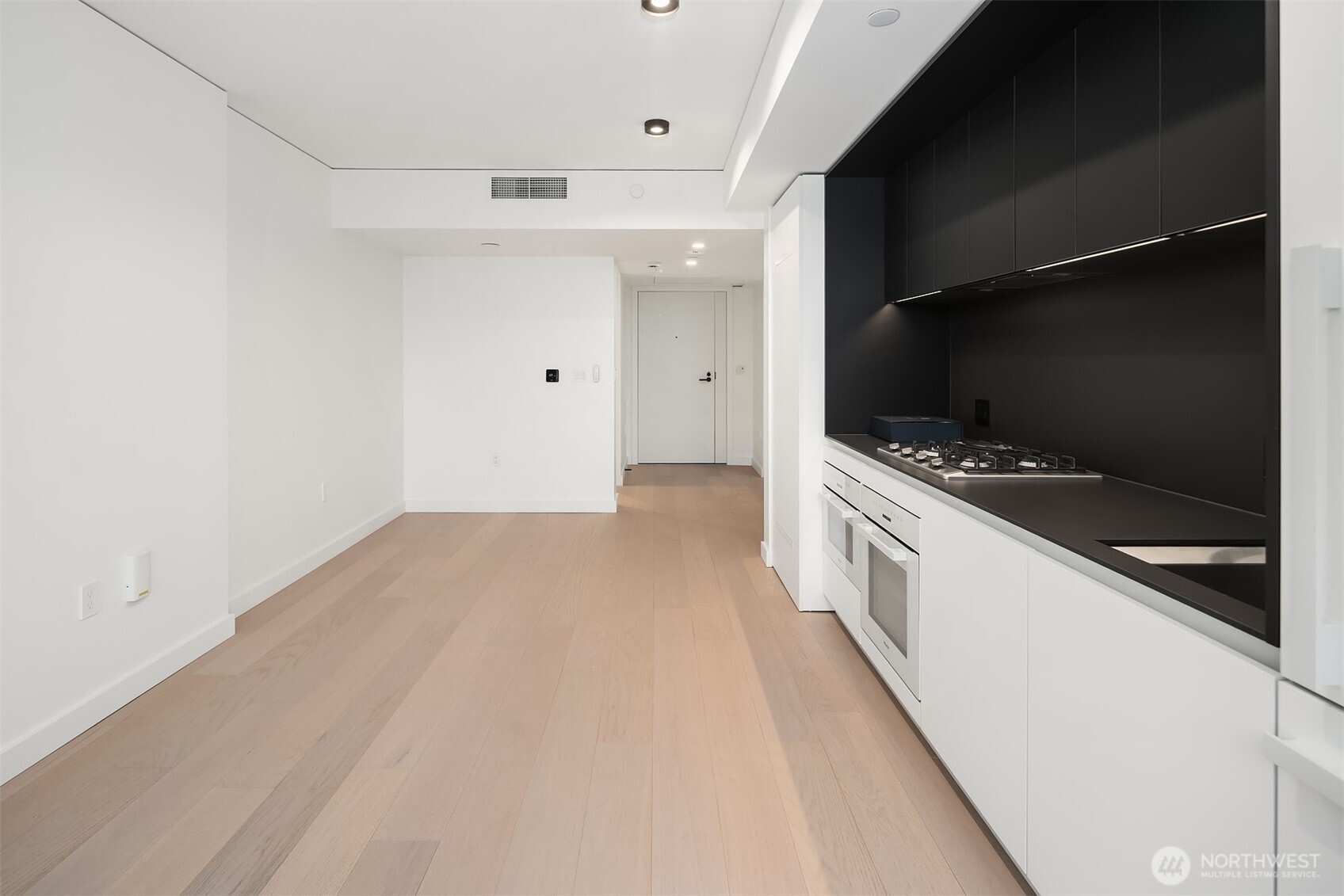 300 Virginia Street, Unit 3103 Seattle, WA 98101 - Photo 7 of 36 a view of kitchen with wooden floor