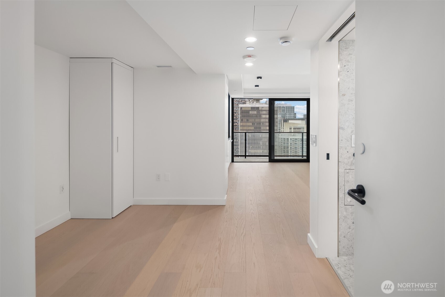 300 Virginia Street, Unit 3103 Seattle, WA 98101 - Photo 8 of 36 wooden floor in an empty room