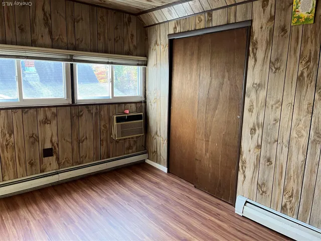 a view of front door with wooden floor