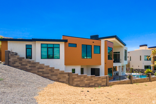 3606 South Cypress Road Hurricane, UT 84737 - Photo 10 of 69 Back of house featuring stucco siding, an outdoor pool, and a patio area
