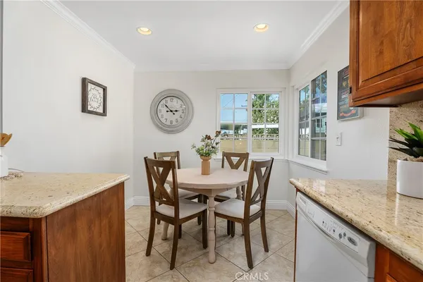 a view of a kitchen with a table and chairs