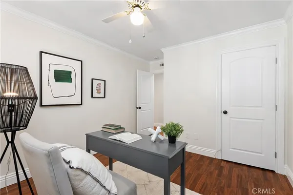 a workspace with furniture and wooden floor