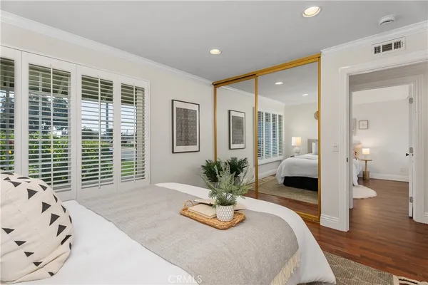 a bedroom with a large bed and a large window