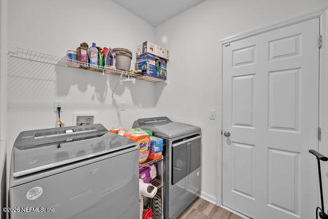 136 Peace River Road St. Johns, FL 32259 - Photo 18 of 40 a utility room with dryer and washer