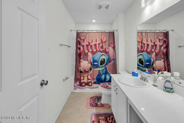 136 Peace River Road St. Johns, FL 32259 - Photo 25 of 40 a bathroom with a sink mirror and vanity