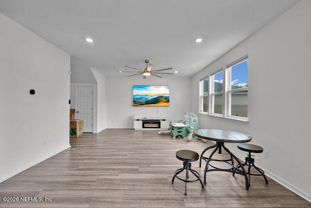 136 Peace River Road St. Johns, FL 32259 - Photo 37 of 40 a living room with furniture and a wooden floor
