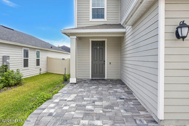 136 Peace River Road St. Johns, FL 32259 - Photo 4 of 40 a view of a house with a white door and a yard
