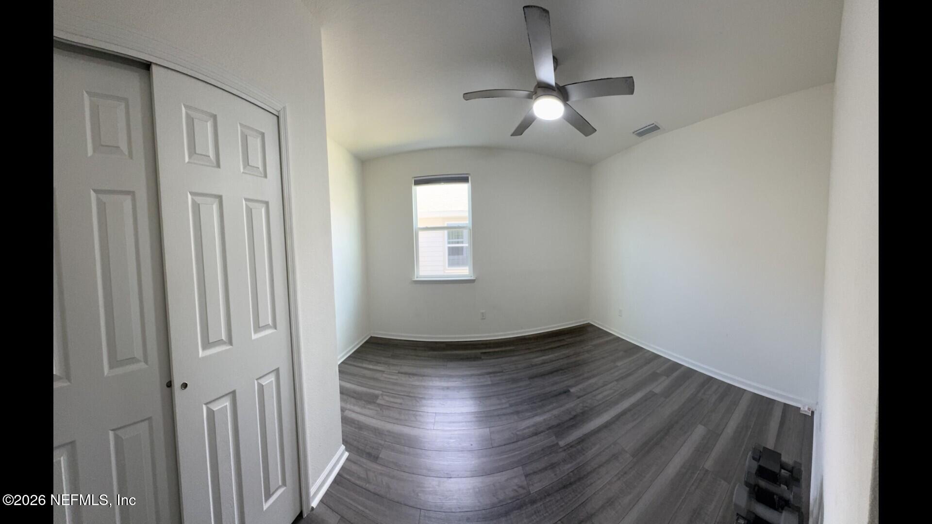 136 Peace River Road St. Johns, FL 32259 - Photo 7 of 40 an empty room with wooden floor chandelier and windows