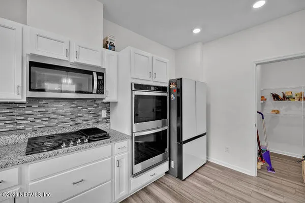 a view of a dining room kitchen and a window