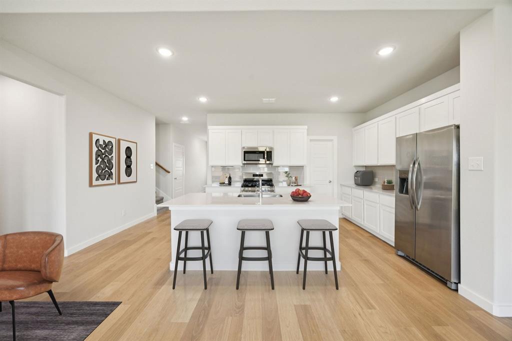 1160 Del Rio Drive Lavon, TX 75166 - Photo 6 of 34 Kitchen in the Masters home plan by Trophy Signature Homes – REPRESENTATIVE PHOTO