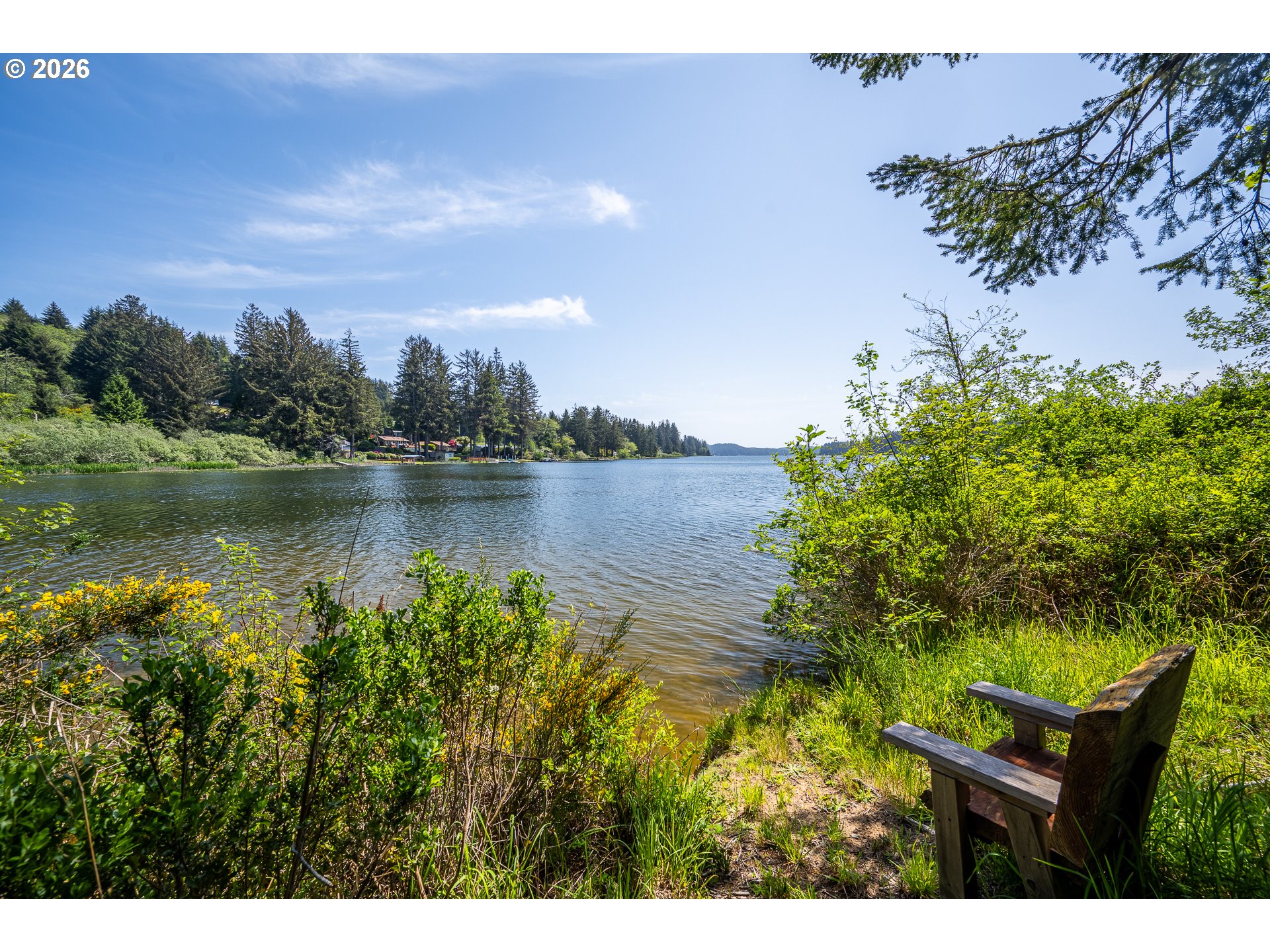 Clear Lake Road, Unit 7 Florence, OR 97439 - Photo 8 of 12 a view of a lake with houses in the back