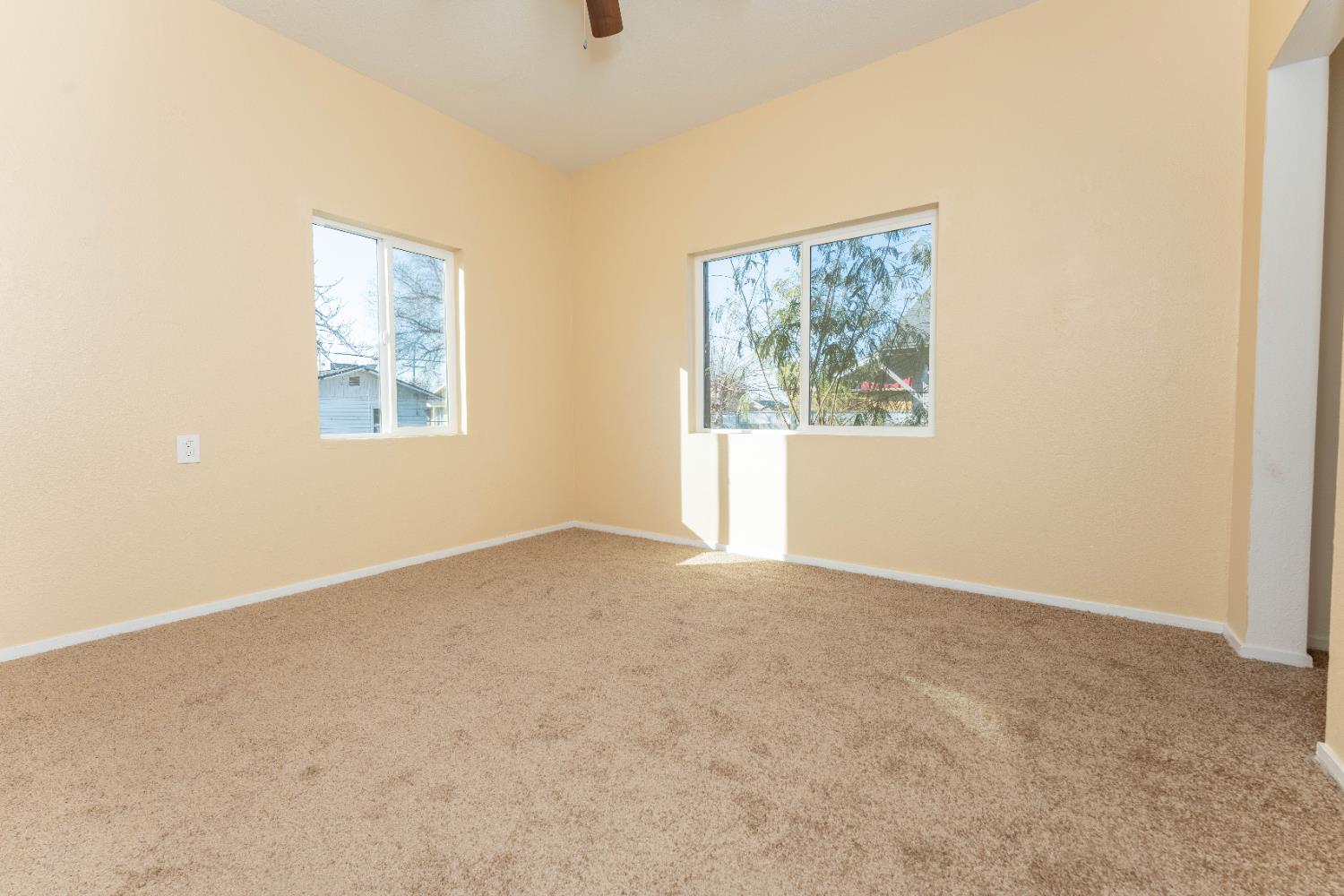 4354 East Kings Canyon Road Fresno, CA 93702 - Photo 23 of 70 an empty room with windows