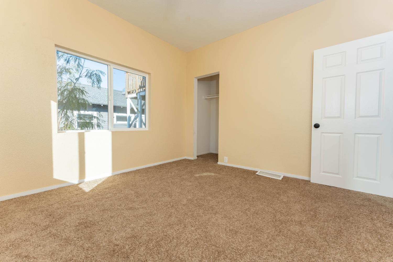 4354 East Kings Canyon Road Fresno, CA 93702 - Photo 24 of 70 a view of an empty room with a window