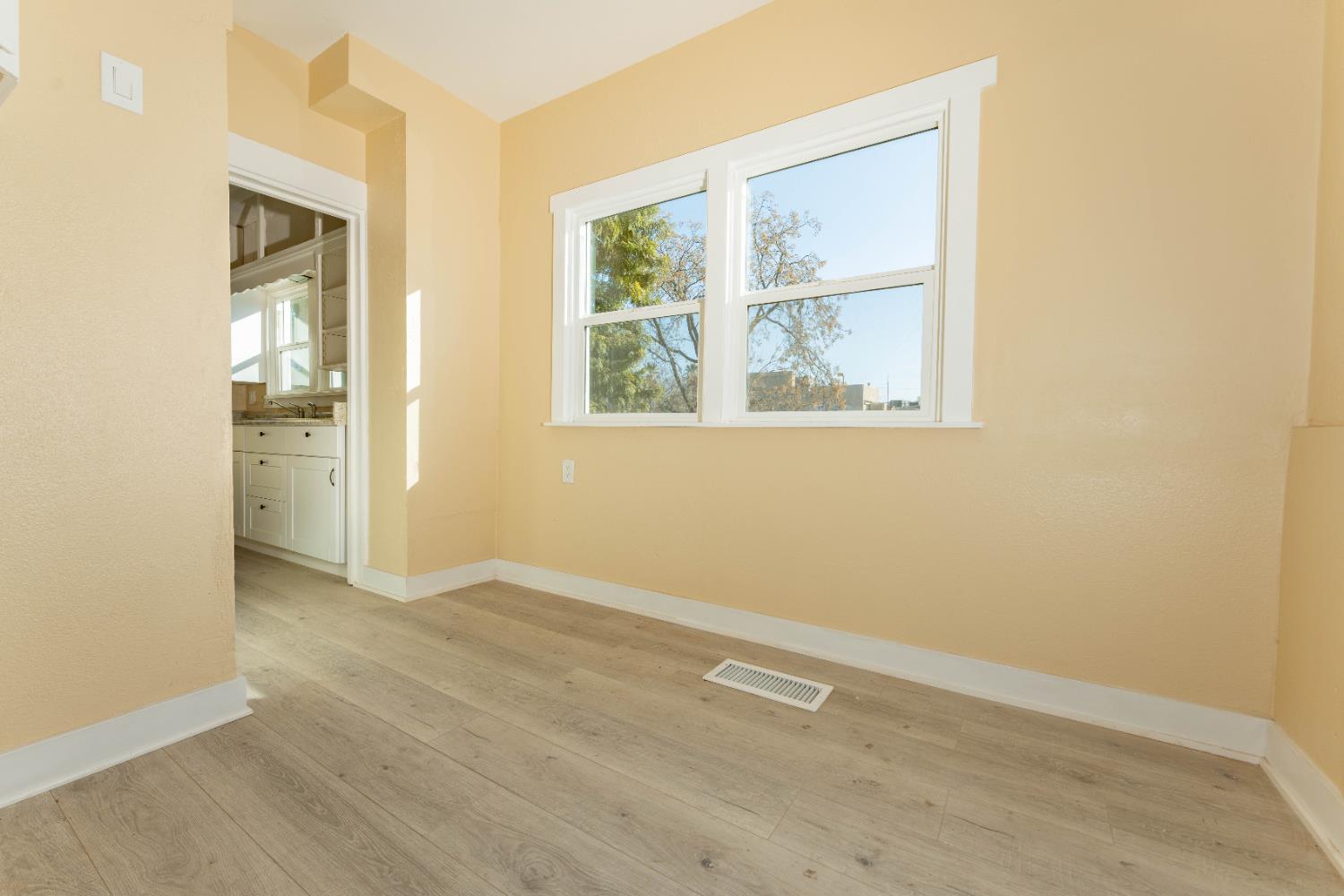 4354 East Kings Canyon Road Fresno, CA 93702 - Photo 29 of 70 an empty room with windows and closet