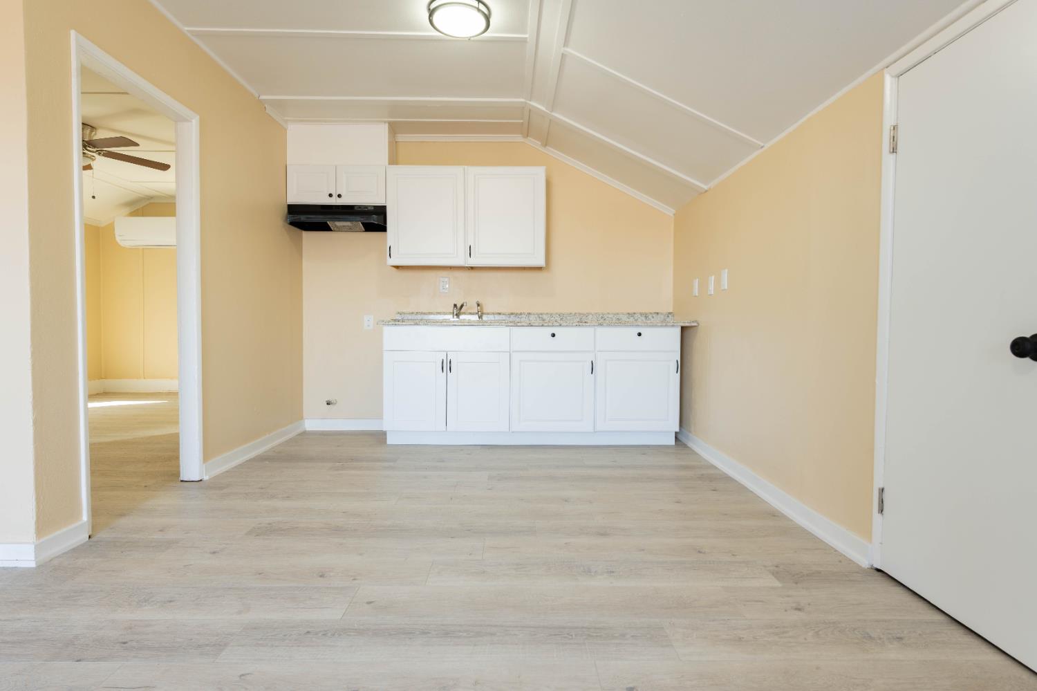 4354 East Kings Canyon Road Fresno, CA 93702 - Photo 37 of 70 a view of a kitchen with white cabinets