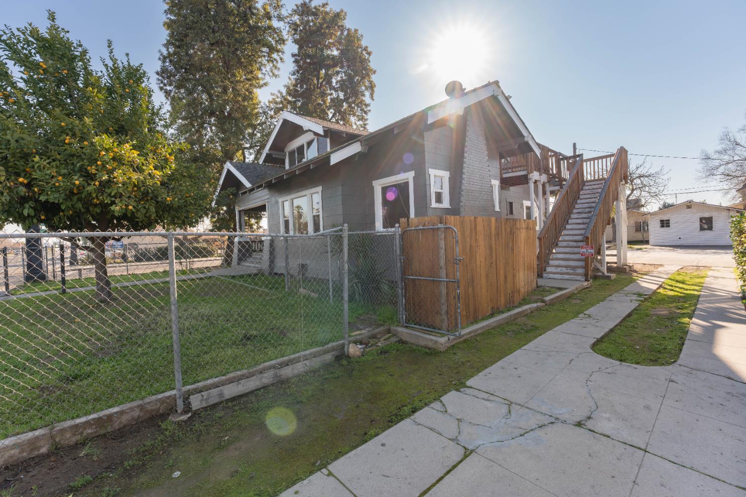4354 East Kings Canyon Road Fresno, CA 93702 - Photo 4 of 70 a view of a house with a yard