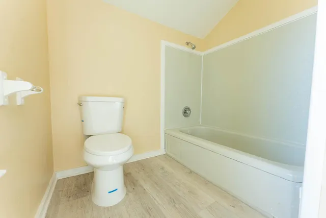 a bathroom with a sink vanity granite and a mirror