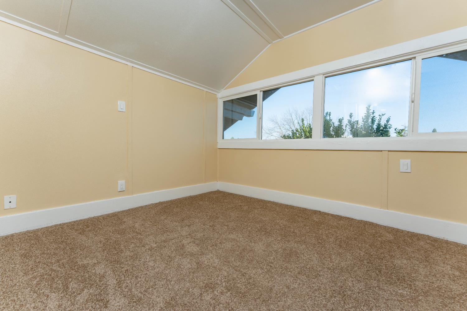 4354 East Kings Canyon Road Fresno, CA 93702 - Photo 44 of 70 an empty room with a window