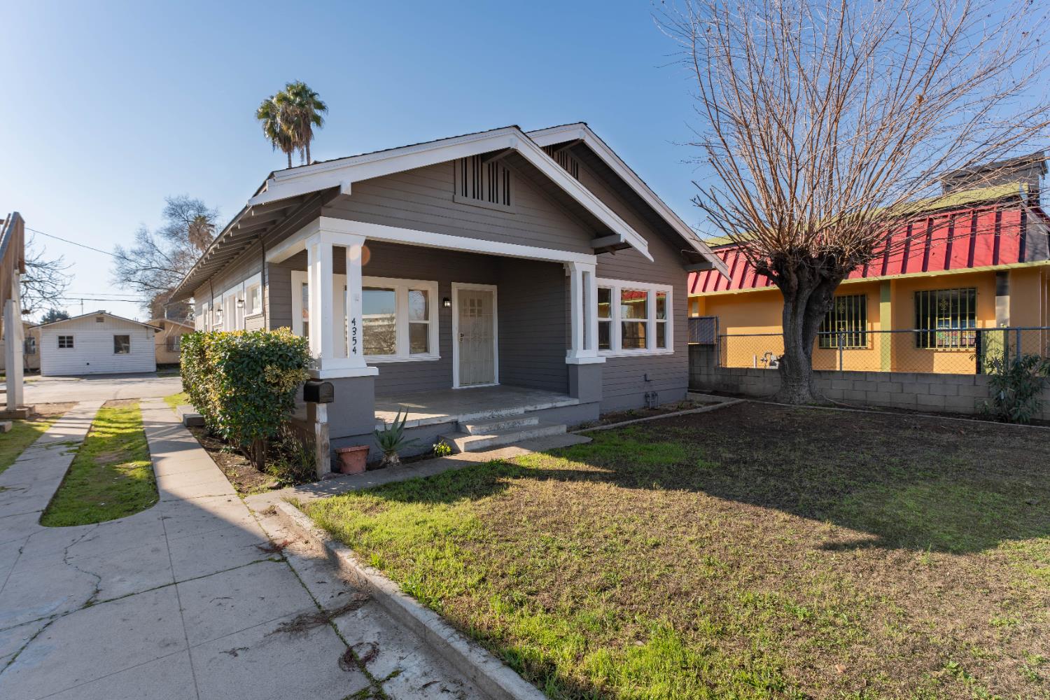 4354 East Kings Canyon Road Fresno, CA 93702 - Photo 48 of 70 a front view of a house with garden