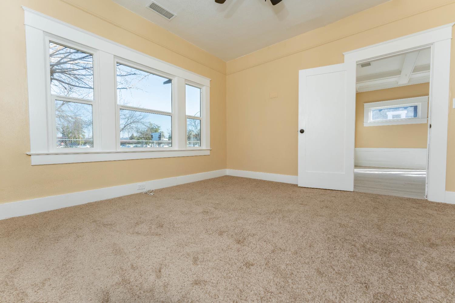 4354 East Kings Canyon Road Fresno, CA 93702 - Photo 58 of 70 an empty room with windows