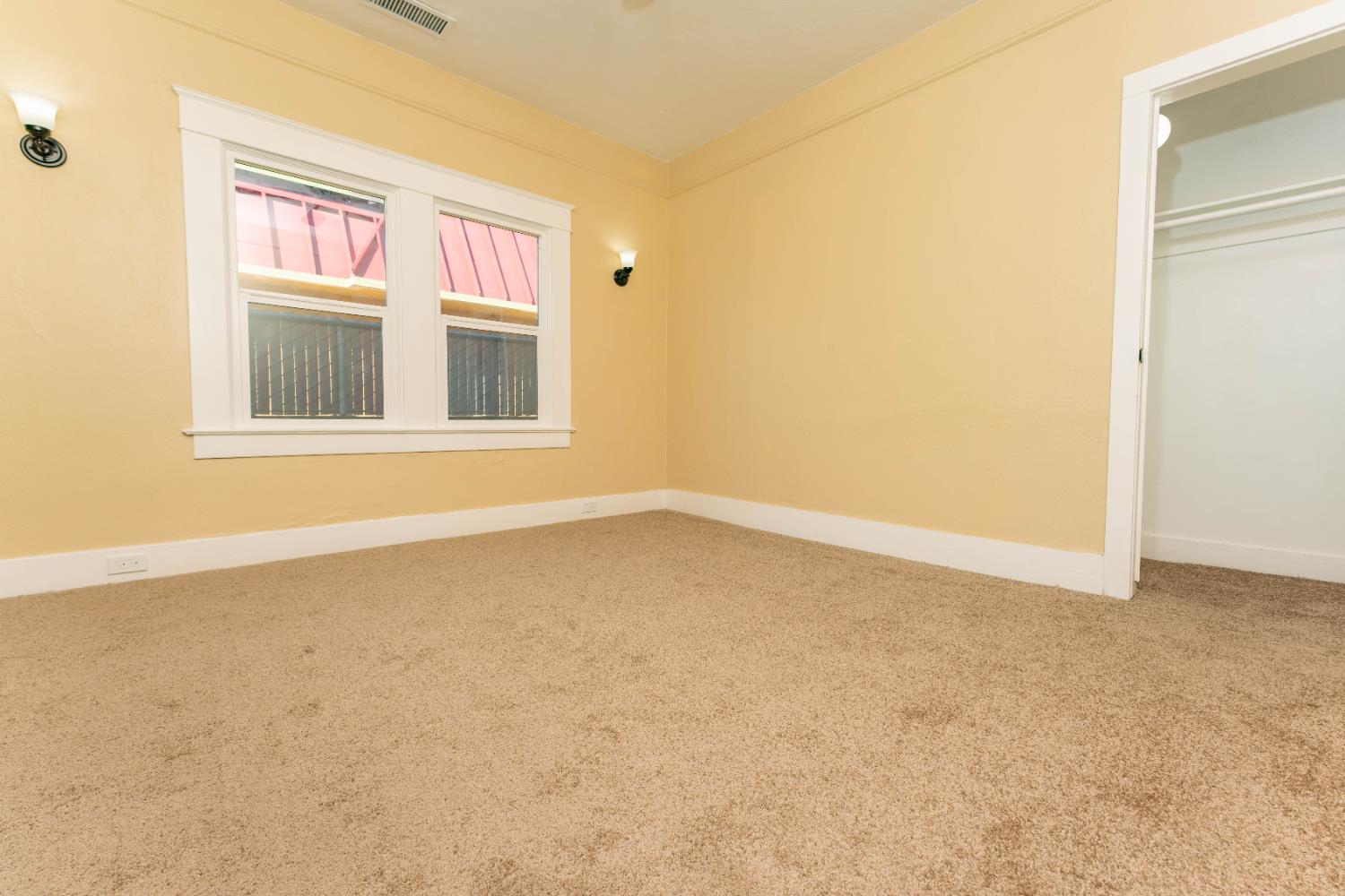 4354 East Kings Canyon Road Fresno, CA 93702 - Photo 65 of 70 an empty room with a window