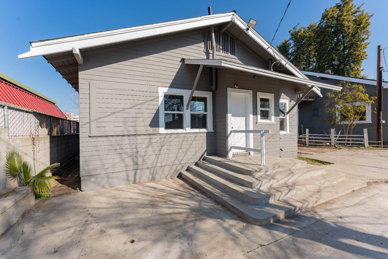 4354 East Kings Canyon Road Fresno, CA 93702 - Photo 69 of 70 a front view of a house with a garage