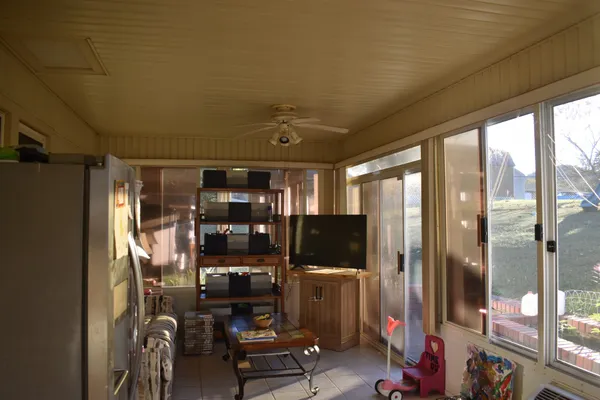 a view of a livingroom with furniture and windows