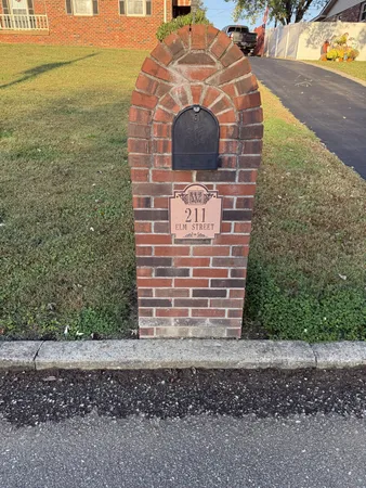 a brick building with a yard