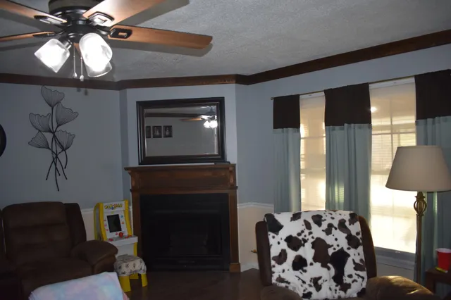 a living room with a couch and a chandelier