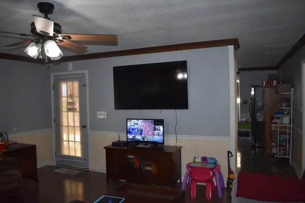 a living room with furniture and a flat screen tv