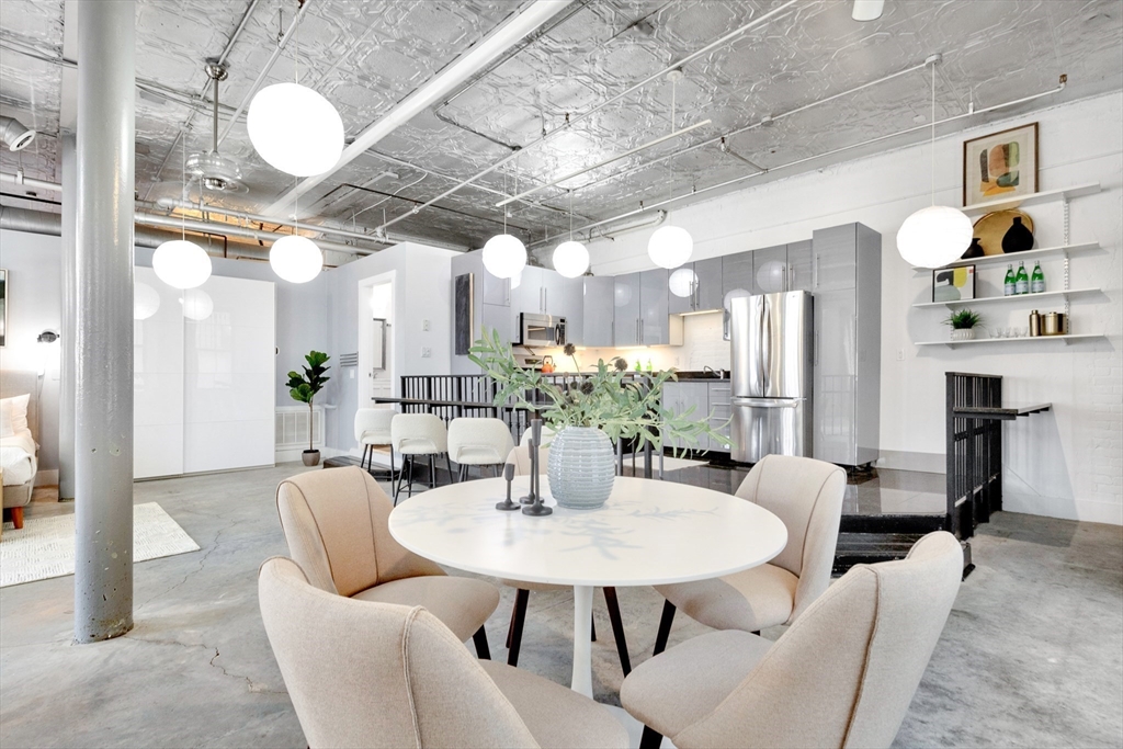 10 Williams Street, Unit 13 Boston, MA 02119 - Photo 27 of 38 a view of a dining room with furniture