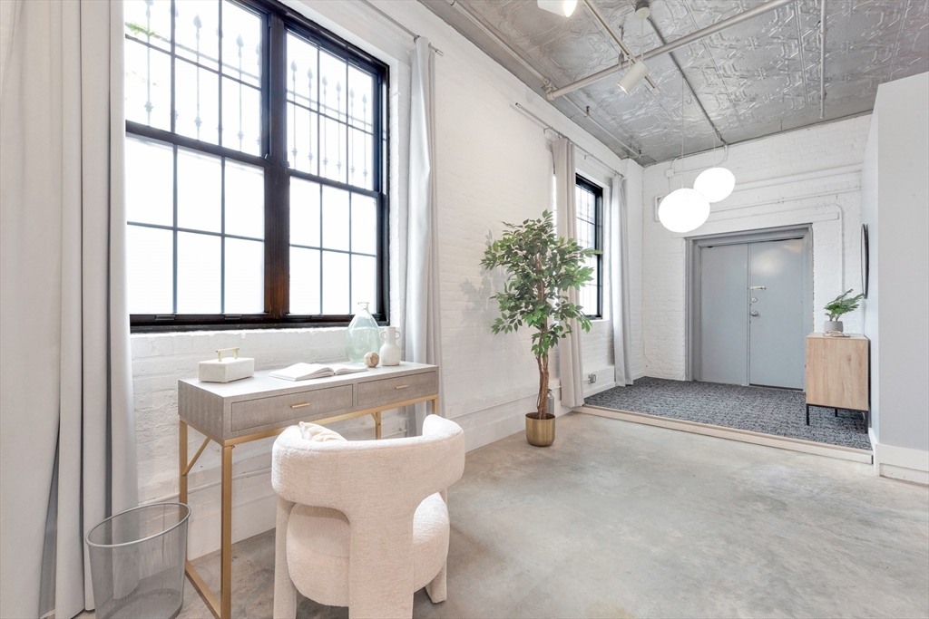 10 Williams Street, Unit 13 Boston, MA 02119 - Photo 30 of 38 a spacious bathroom with a tub and shower