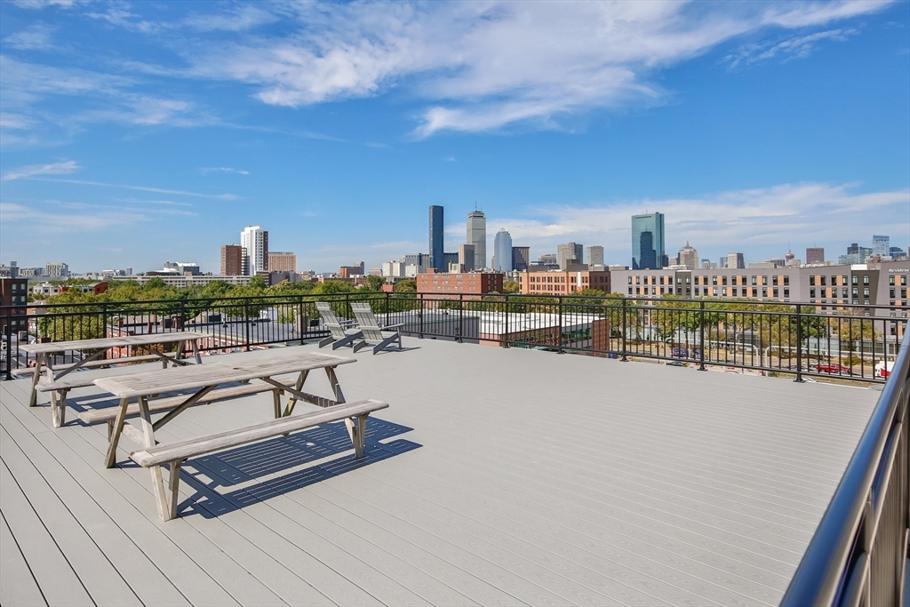 10 Williams Street, Unit 13 Boston, MA 02119 - Photo 38 of 38 a view of a terrace with wooden benches